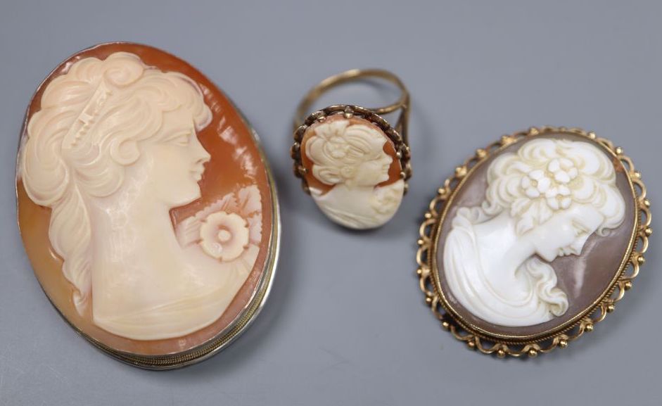 A 9ct gold and oval cameo shell ring, size N, gross 5.8 grams, a 9ct gold mounted cameo brooch and a 925 mounted cameo brooch